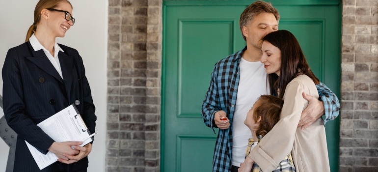 a family with a real estate agent inspecting a home in one of the best neighborhoods in San Dimas