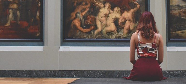 a woman enjoying a museum