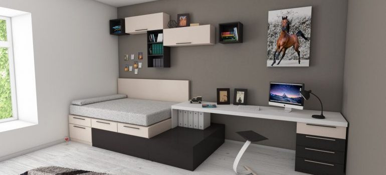 Bedroom with desk and bed.
