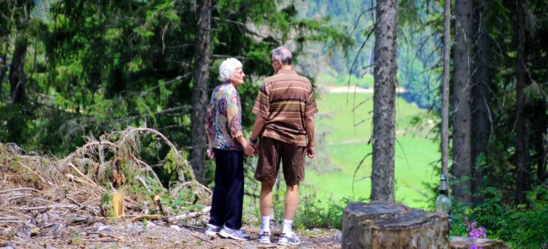 an elderly couple taking a break in the forest in one of the best LA places for retirement