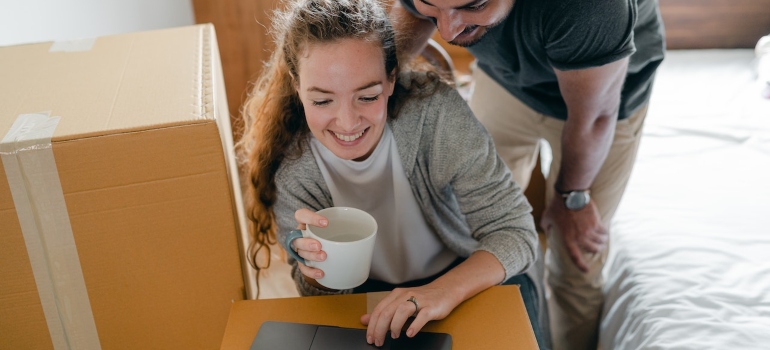 a couple making a moving plan form scratch 